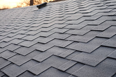 Inspecting a shingle roof for weather damage